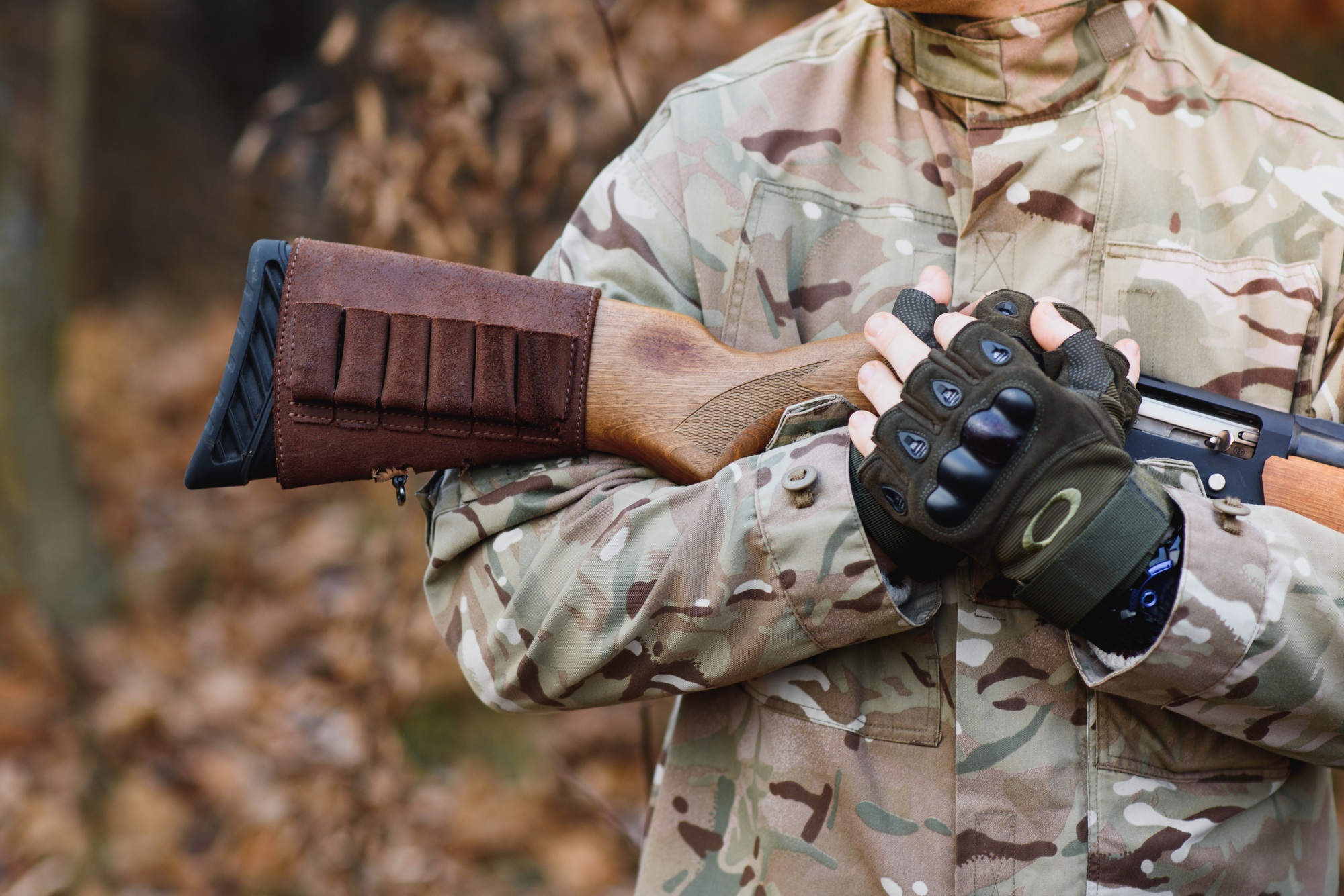 Hunting equipment. Brutal masculine hobby. Man observing nature background.