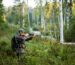 Hunter aiming with weapon at the outdoor hunting